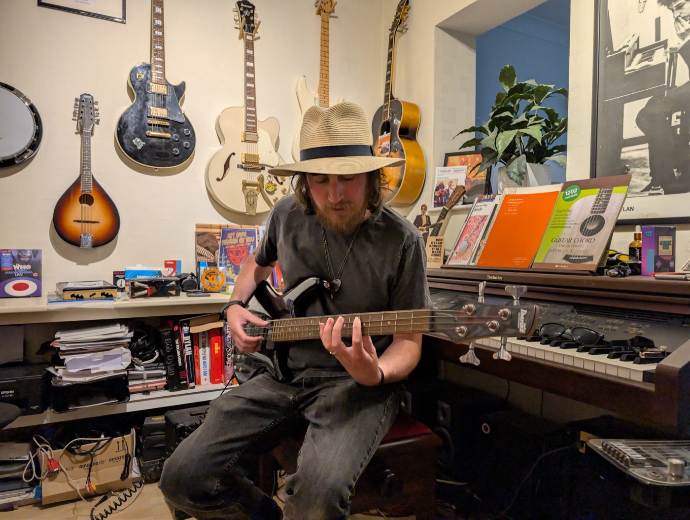 Harry playing guitar in his Southend-on-Sea teaching studio